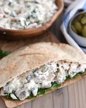 Whole wheat pita bread stuffed with lettuce and dill pickle chicken salad.