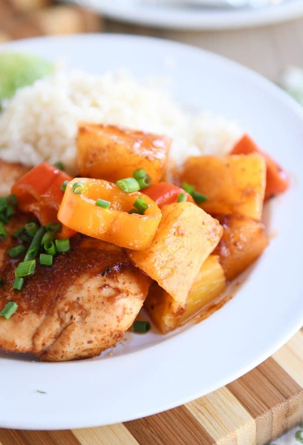 White plate with BBQ Hawaiian Chicken foil packet meal and cauliflower rice.