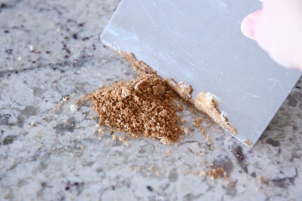 Bench scraper cleaning counter.