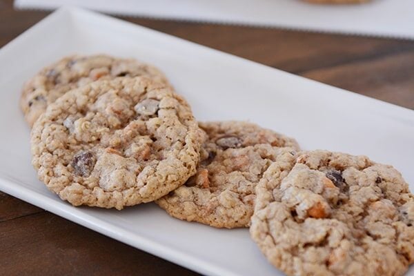 A white tray of oatmeal chocolate chip butterscotch cookies.