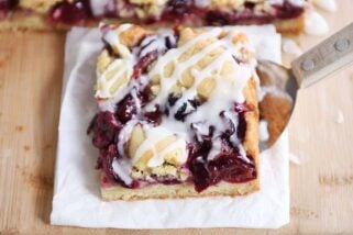 Cherry pie cookie bar on white napkin.