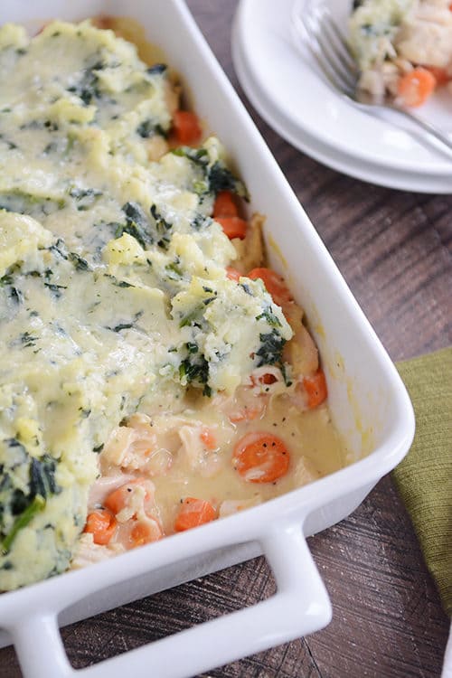 A casserole dish full of chicken shepherd's pie topped with kale mashed potatoes.