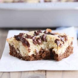 Square of choco-banana bars on white napkin.