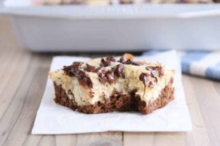Square of choco-banana bars on white napkin.