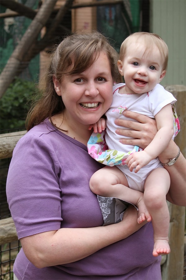 A woman holding a baby girl.