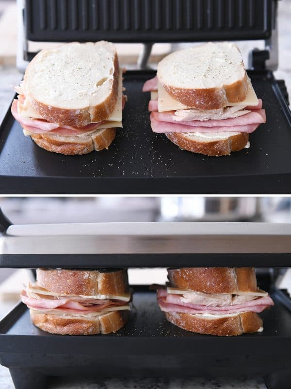 Chicken cordon bleu panini getting cooked on panini press.