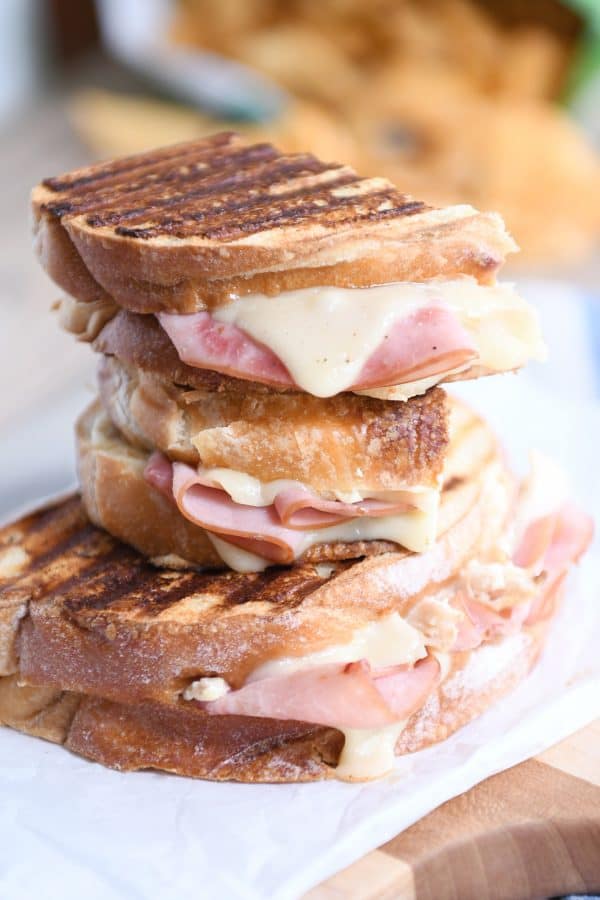 Three stacked chicken cordon bleu sandwiches.
