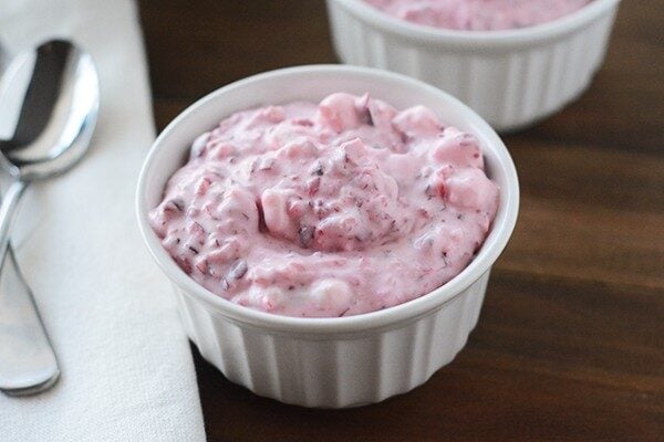 A white ramekin of cranberry fluff salad. 