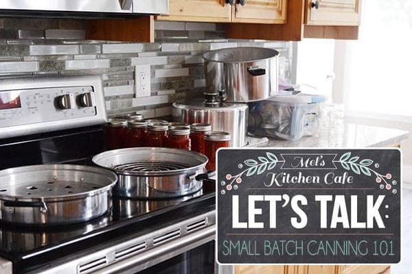 Canning steamer on a stovetop with bottled of canned beets beside it. 