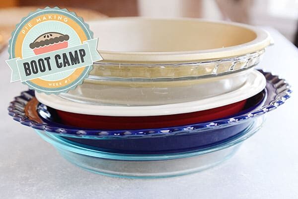 A big stack of various pie dishes. 