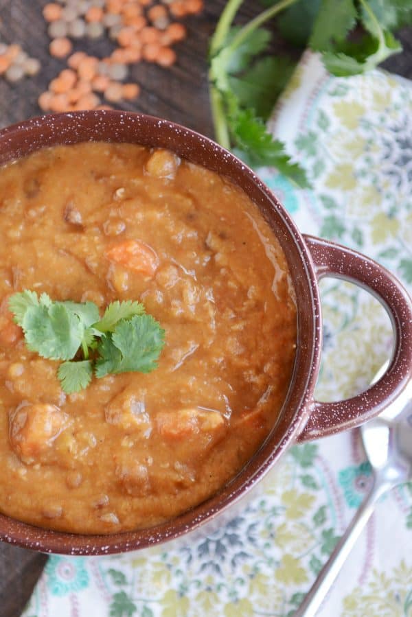 Top view of a pot of thick and creamy lentil soup. 