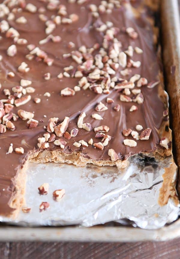 Sheet pan of easy graham cracker toffee with a few pieces taken out.