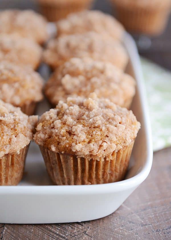 A white dish of pumpkin muffins.