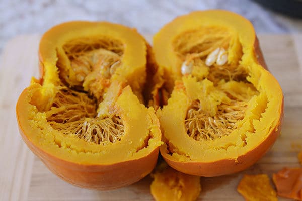 A cooked pumpkin cut in half. 