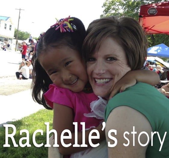 A woman hugging a little girl.