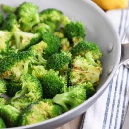 Skillet with roasted broccoli.
