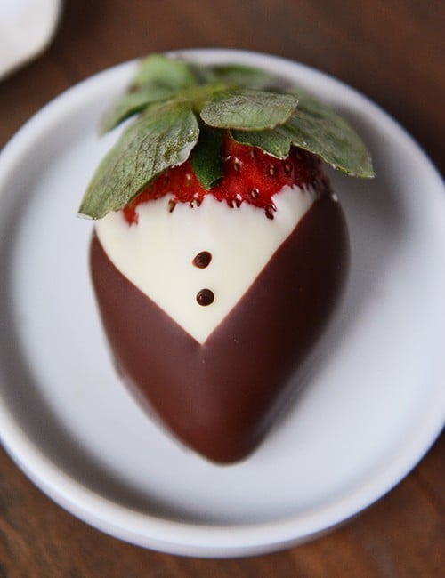 Top view of a tuxedo-style chocolate dipped strawberry. 
