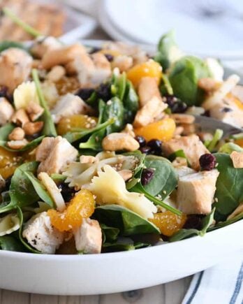 Bowtie pasta salad with teriyaki dressing in large white bowl.