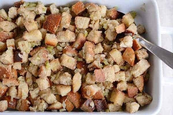 Top view of a white ceramic dish filled with stuffing.