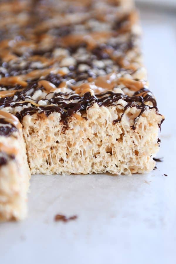 Toasted Coconut Caramel Rice Krispie Treats on parchment paper.