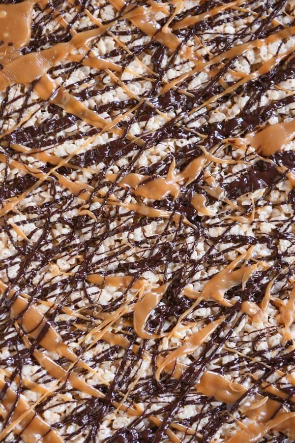 Top down view of Toasted Coconut Caramel Rice Krispie Treats on parchment paper.