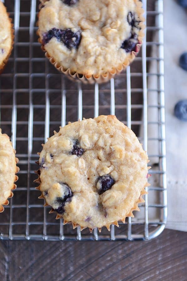 Top view of blueberry muffins on a cooling rack.